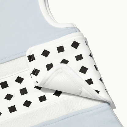 zoomed in on nanit powder blue breathing wear sleeping bag with velcro slightly off 