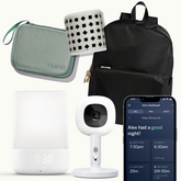 nanit pro flex duo, sound + light, black state bag, breathing band, green travel case, and nanit app showing dashboard screen #color_green
