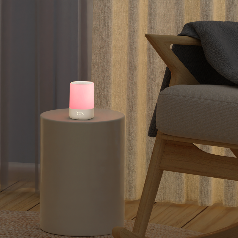 lifestyle image of sound and light in pink light on a side table