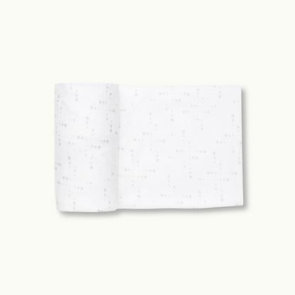 Nanit Knit Crib Sheet - White Sunburst Crib Sheet rolled 
