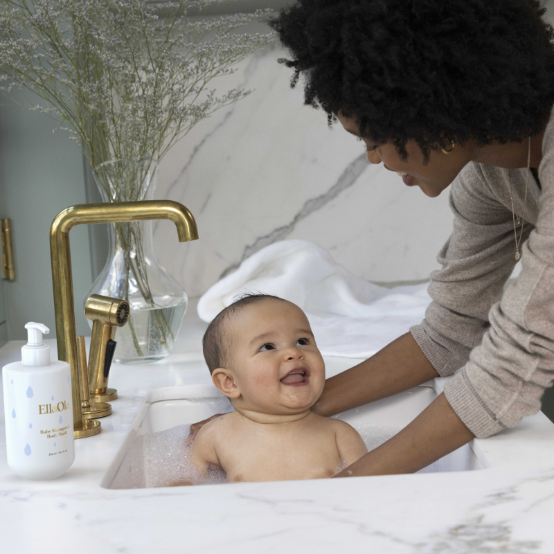 mom taking baby a bath using EllaOla Baby Shampoo & Body Wash